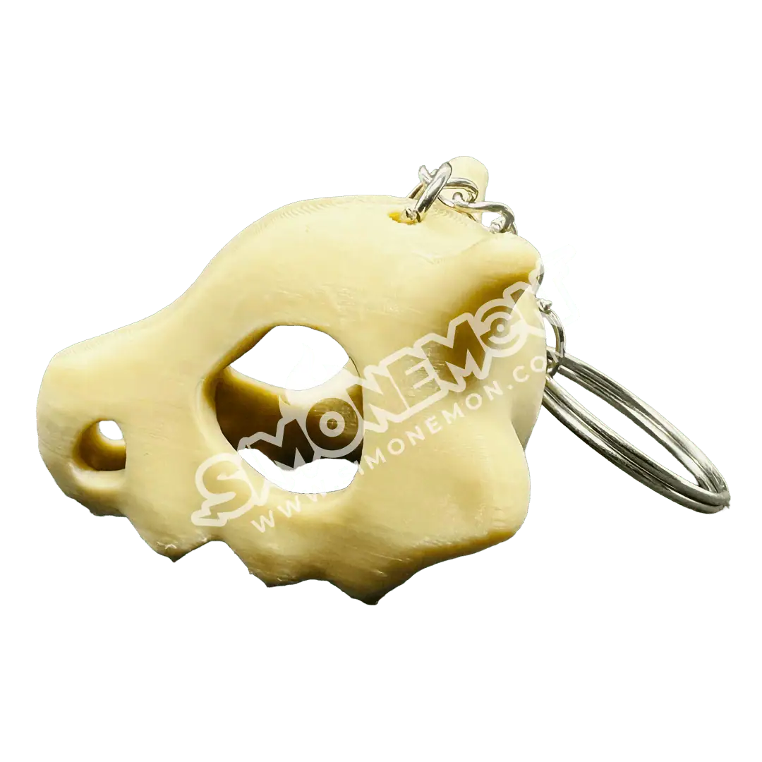 Portachiavi in plastica a forma di testa di orso con anello metallico.
