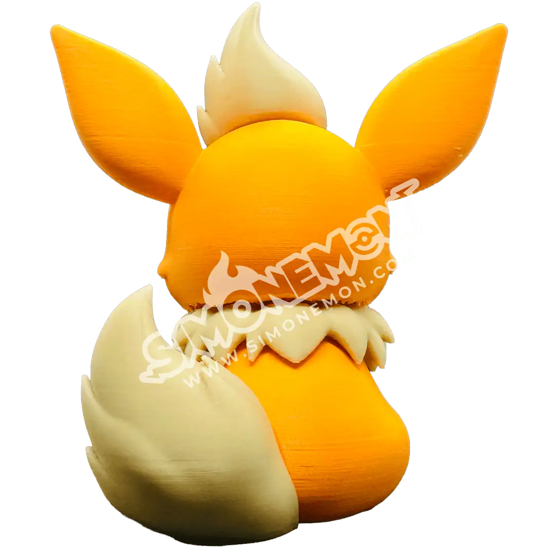 Furry fox figurine with orange and white fur, large ears, and a bushy tail.
