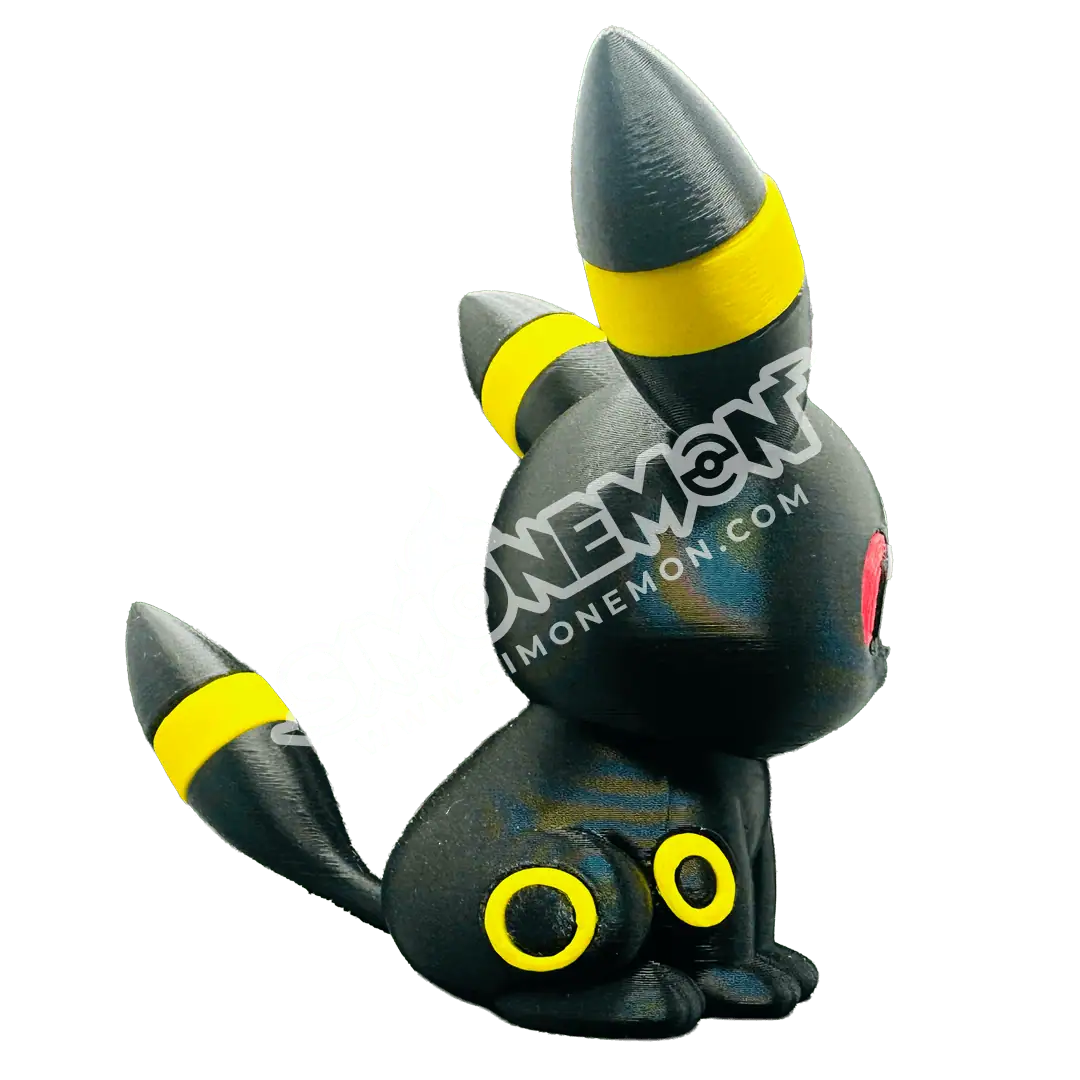 Figura di Umbreon Pokémon in stile collezione con dettagli colorati.