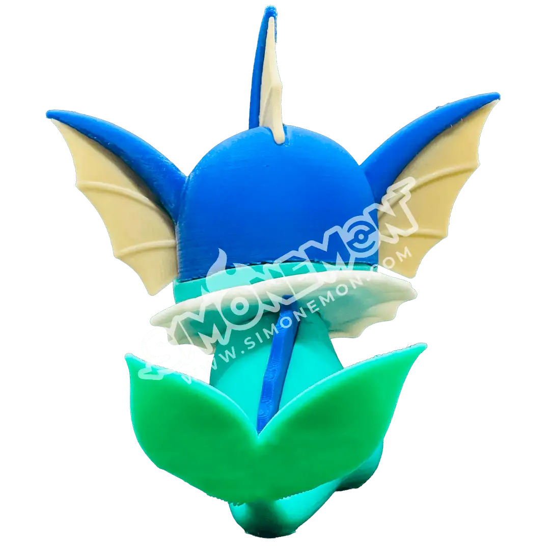 Decorazione a forma di drago in cera blu e verde con dettagli gialli.