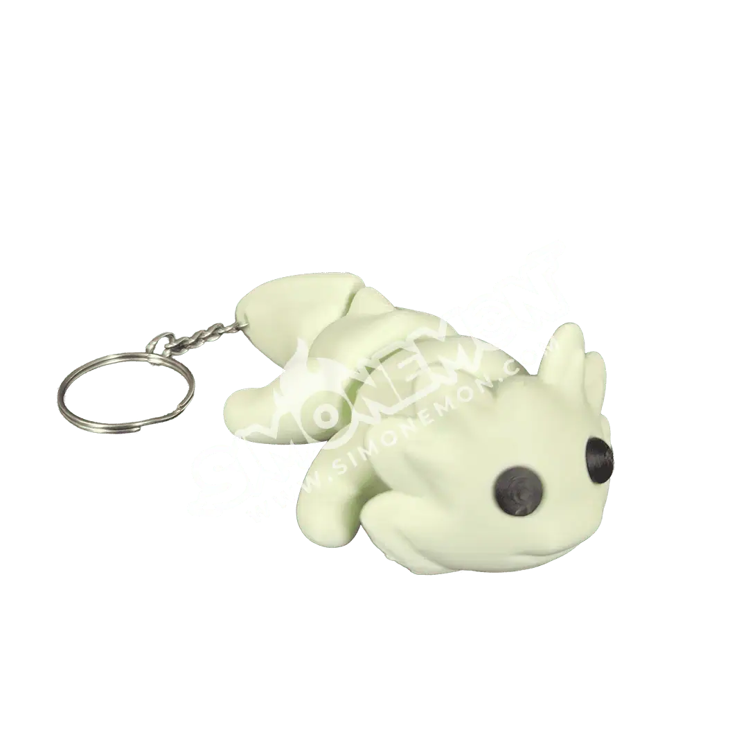 Portachiavi con cagnolino in silicone bianco e nero, oggetto decorativo e funzionale.