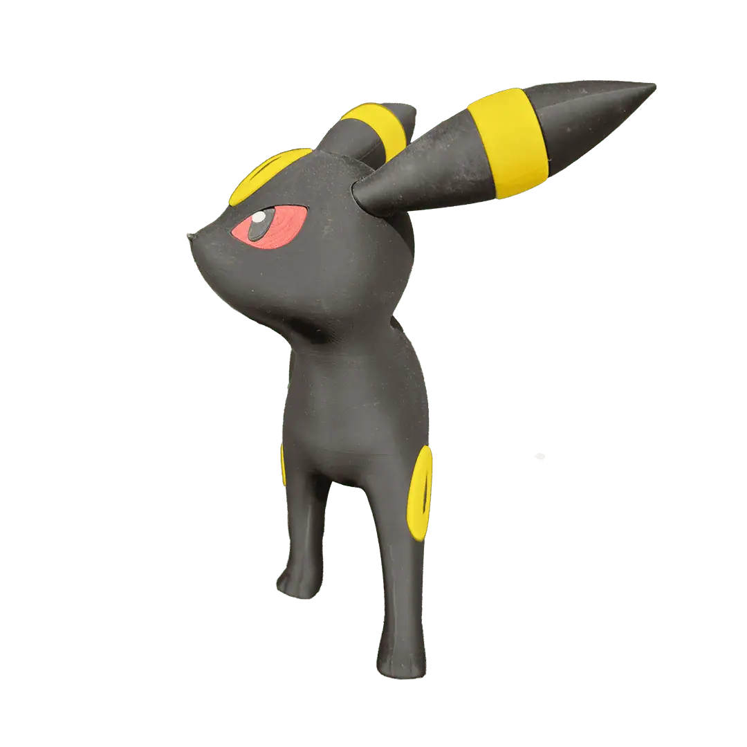 Figura di Pokémon Umbreon in plastica nera con dettagli gialli e occhi rossi.