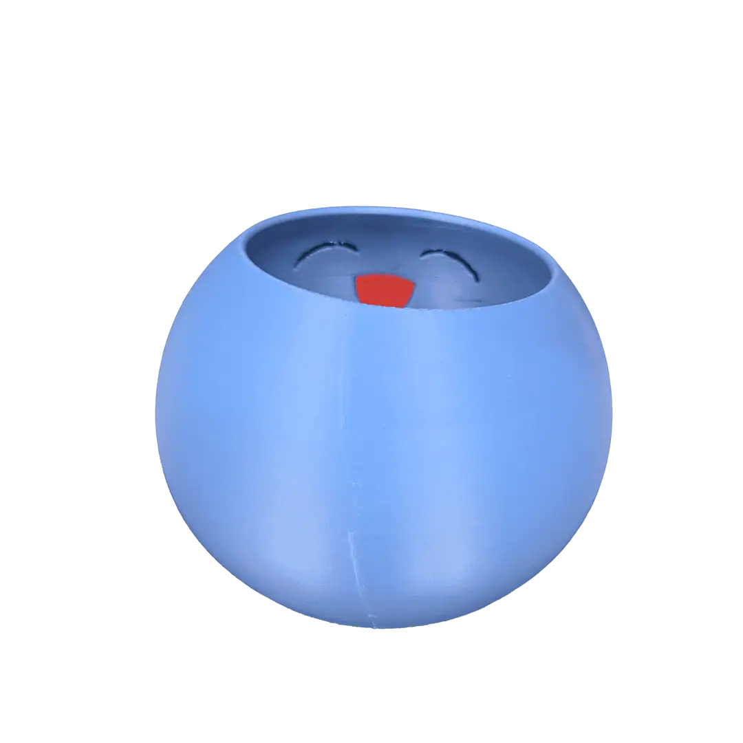 Pupazzo di ciotola blu con faccina sorridente e lingua rossa.